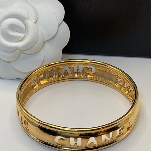 CHANEL Gold Cut Out Logo Bangle - Picture 3 of 10